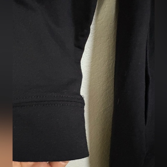 Lisa Bayne Chic Black Long Sleeve Dress with Pockets and Asymmetric Design. - Picture 9 of 14